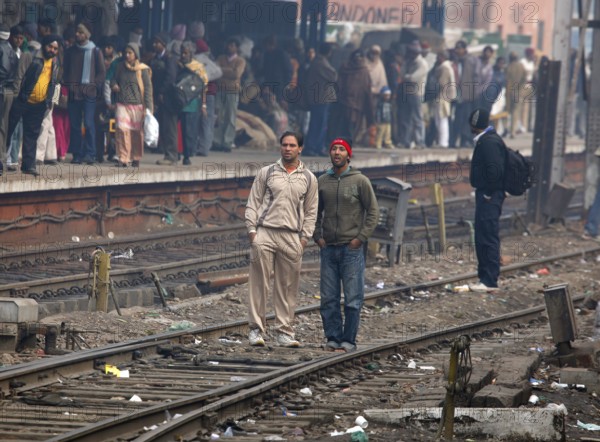 Neu Dehli, India, 15.01.10 - Railway Station in Neu-Dehl, passengers on the tracks, India