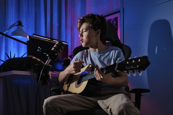 A young guitarist energetically sings into a microphone in a cozy home studio. The ambient lighting adds a vibrant touch, enhancing the passionate musical performance