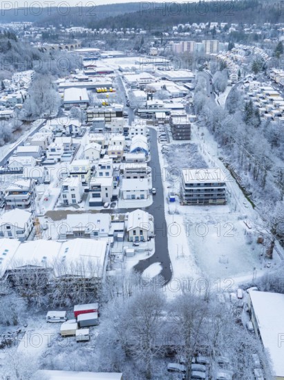 Overview of a snowy cityscape with residential areas and trees, Nagold, Black Forest, Germany