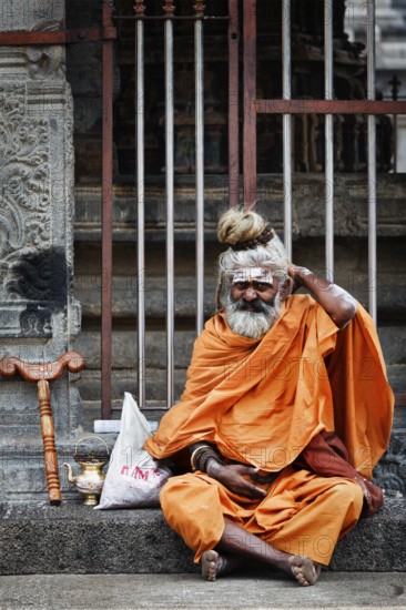 TIRUVANAMALLAI, INDIA, JANUARY 7, 2010: Sadhu, religious ascetic or holy person, in Hindu temple Arunachaleswar. Tiruvanamallai, Tamil Nadu, India