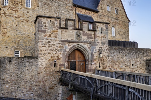 Castle wall with gate and bridge in medieval style, robust and fortified, The gate of Spangenberg Castle