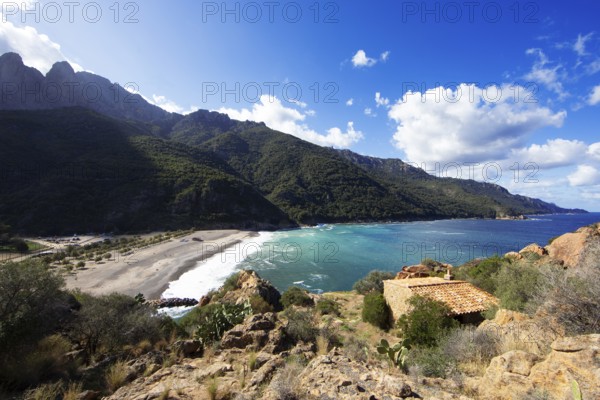View of the pebble beach and Porto Bay, a UNESCO World Heritage Site, Ota, west coast of Corsica, Corse-du-Sud, Corsica, France
