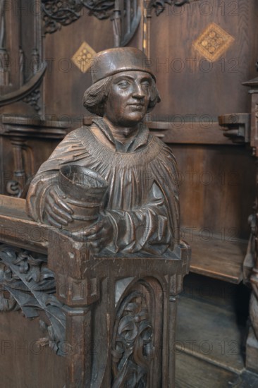 Figure on the late Gothic choir stalls from 1507, St Martin, Memmingen, Bavaria, Germany