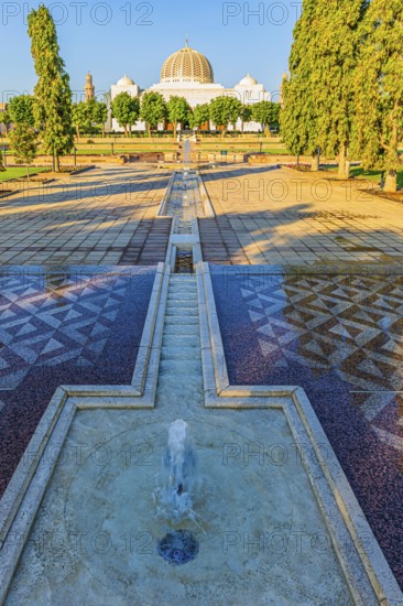 Park of the Sultan Qaboos Mosque, behind the mosque with the domes and minarets, Muscat, Arabian Peninsula, Sultanate of Oman
