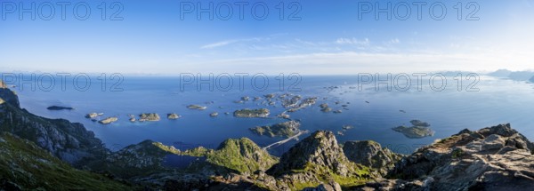Panorama, view of the sea with numerous small rocky islands with houses, at the summit of Festvågtind, view of Henningsvær, Vågan, Lofoten, Nordland, Norway