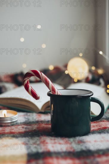 Cozy Christmas setting featuring a steaming mug and a candy cane resting on an open book, surrounded by soft lighting and festive decorations to evoke a sense of holiday warmth and cheer