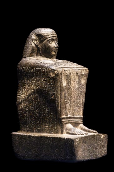 Block statue of the vizier Paser with emblems of the gods of Thebes, from the exhibition: Ramses the Great and the Gold of the Pharaohs, Cologne, North Rhine-Westphalia, Germany