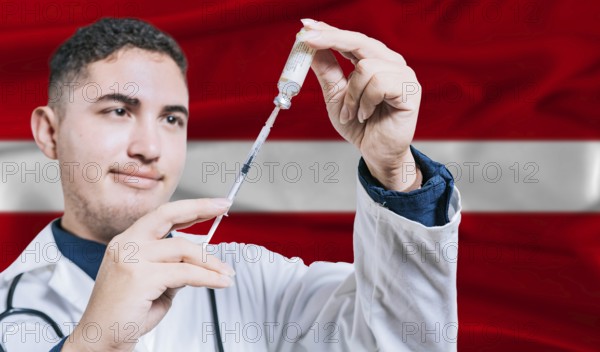 Doctor holding syringe on Latvia flag background. Medical professional holding syringe with Latvian flag in the background