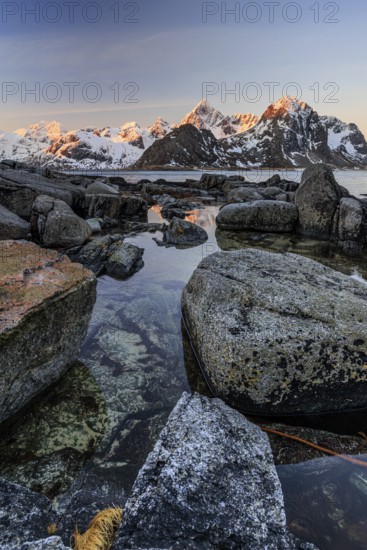 Sunrise, morning light, steep mountains by the sea, winter, Flakstadoya, Lofoten, Norway