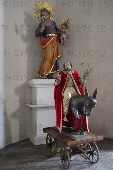 Palmesel, behind a sculpture of the Virgin Mary in the parish church of St Peter and St Paul, Kirchstraße 25, Telfs, Tyrol, Austria