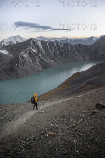 Mountaineer at Ala Köl mountain lake, in the Tien Shan Mountains, near Altyn Arashan, Kyrgyzstan