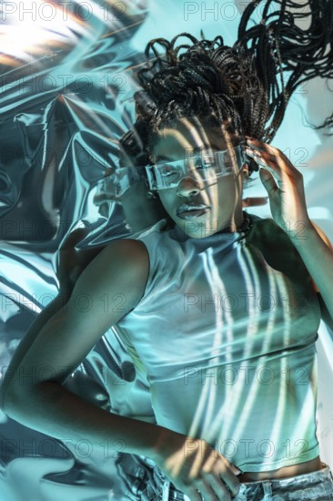 A futuristic young African woman wearing high-tech glasses, immersed in a vibrant and digital metaverse environment, symbolizing innovation and virtual reality