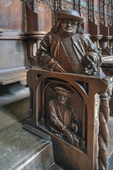Figures on the late Gothic choir stalls from 1507, St Martin, Memmingen, Bavaria, Germany