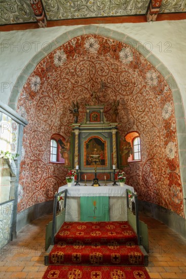 Interior and altar, walls with colourful frescoes in the Romanesque fieldstone church in the village of Raben, Rabenstein, Fläming, Brandenburg, Germany