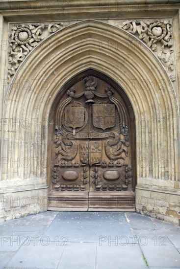 Wooden carved door of the abbey church, Bath, England, United Kingdom