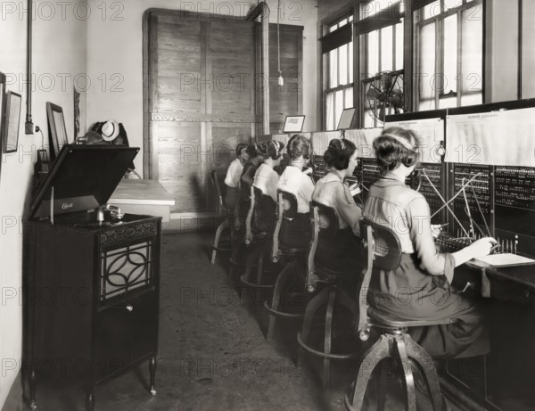 Switchboard operators listening to the Edison‘s phonograph, 1919, digitally edited