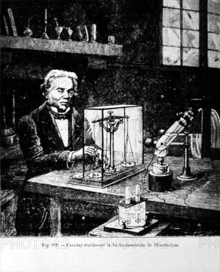 Michael Faraday in his workshop