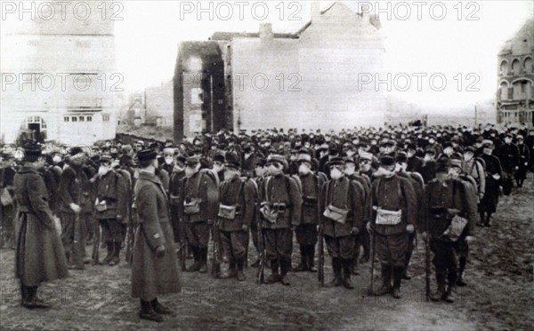 World War I. Military company equipped with gas masks being reviewed at the front