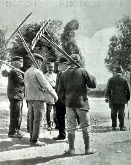 World War I. French President Clemenceau talking with farmers from a village near the front