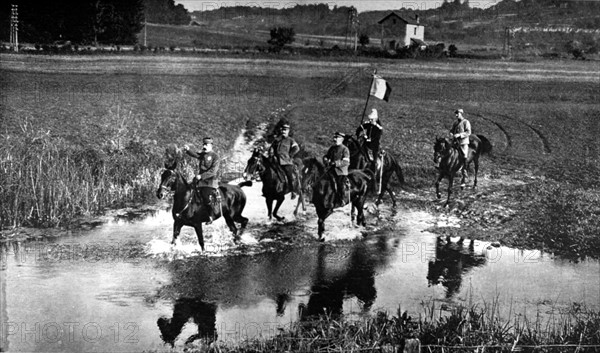 World War I. On an inspection tour in Alsace, General Dubail fords a river (1915)