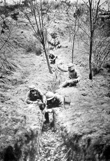 World War I. After a bombardment, the telephone sappers laying a telephone line (1918)