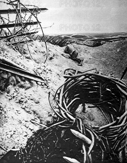 World War I. A French officer examining enemy  lines  from a crater in Champagne (1915)