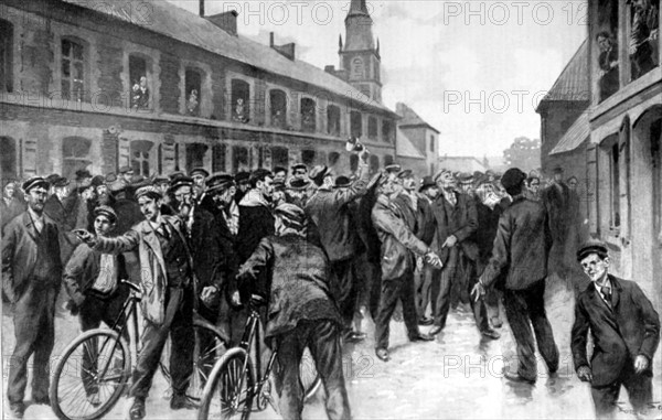 A line of miners on strike in the streets of Lourches (1902)