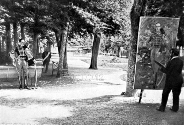 Alfonso XIII of Spain posing in the park of la Granja castle, before painter Sorolla, in 1907