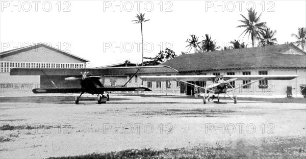 In central America, meeting of the pilotes who have flown over the South and the North Atlantic (1928). 'Nungesser-Coli' and the 'Spirit of St-Louis' in front of the Coton airplane hangars