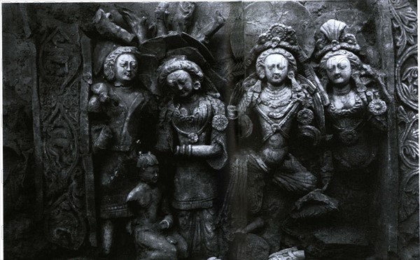 Two couples of a legend scene, clay relief