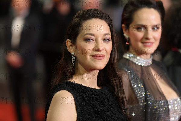 Noémie Merlant (in custom Louis Vuitton) and Marion Cotillard (in custom Chanel) attend the "Roma Elastica" screening during the 79th annual Cannes Film Festival at Palais des Festivals on May 20, 2026 in Cannes, France.