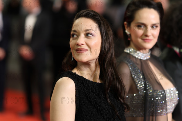 Noémie Merlant (in custom Louis Vuitton) and Marion Cotillard (in custom Chanel) attend the "Roma Elastica" screening during the 79th annual Cannes Film Festival at Palais des Festivals on May 20, 2026 in Cannes, France.