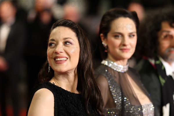 Noémie Merlant (in custom Louis Vuitton) and Marion Cotillard (in custom Chanel) attend the "Roma Elastica" screening during the 79th annual Cannes Film Festival at Palais des Festivals on May 20, 2026 in Cannes, France.