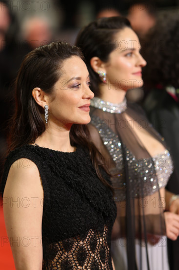 Noémie Merlant (in custom Louis Vuitton) and Marion Cotillard (in custom Chanel) attend the "Roma Elastica" screening during the 79th annual Cannes Film Festival at Palais des Festivals on May 20, 2026 in Cannes, France.