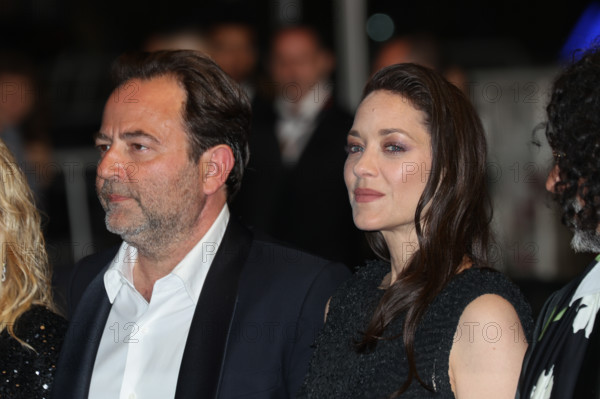 Thomas Verhaeghe, Marion Cotillard (in custom Chanel), Bertrand Mandico, attend the "Roma Elastica" screening during the 79th annual Cannes Film Festival at Palais des Festivals on May 20, 2026 in Cannes, France.