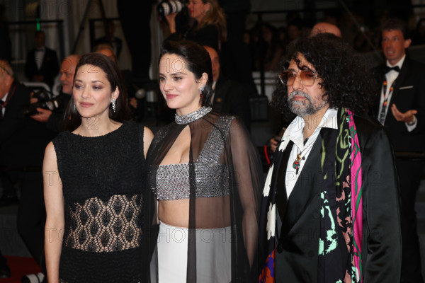 Marion Cotillard (in custom Chanel), Bertrand Mandico, Noémie Merlant (in custom Louis Vuitton)  attend the "Roma Elastica" screening during the 79th annual Cannes Film Festival at Palais des Festivals on May 20, 2026 in Cannes, France.