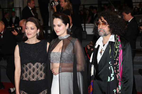Marion Cotillard (in custom Chanel), Bertrand Mandico, Noémie Merlant (in custom Louis Vuitton)  attend the "Roma Elastica" screening during the 79th annual Cannes Film Festival at Palais des Festivals on May 20, 2026 in Cannes, France.