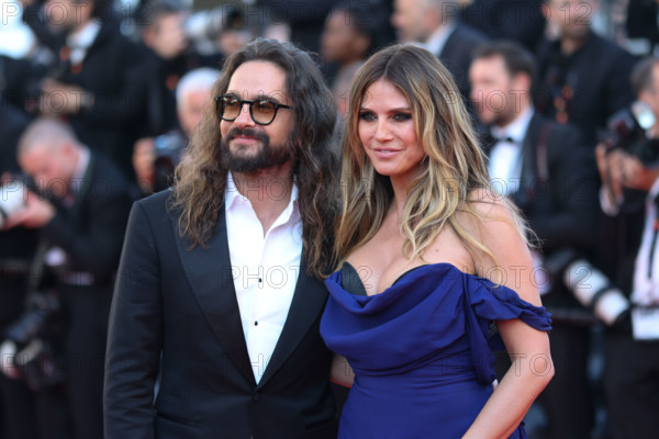 Heidi Klum (in Vivienne Westwood) and Tom Kaulitz attend the "La Bataille De Gaulle: L'Âge De Fer" (De Gaulle: Tilting Iron) screening during the 79th annual Cannes Film Festival at Palais des Festivals on May 20, 2026 in Cannes, France.