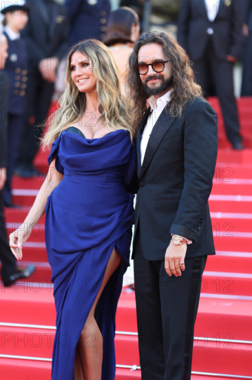Heidi Klum (in Vivienne Westwood) and Tom Kaulitz attend the "La Bataille De Gaulle: L'Âge De Fer" (De Gaulle: Tilting Iron) screening during the 79th annual Cannes Film Festival at Palais des Festivals on May 20, 2026 in Cannes, France.