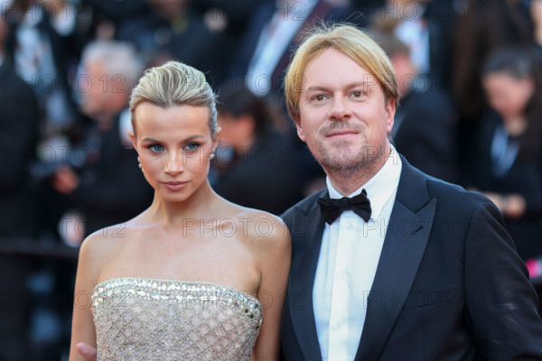 Simona Jakstaite (in Georges Hobeika) and Christopher Aleo attend the "Histoires De La Nuit" (The Birthday Party) screening during the 79th annual Cannes Film Festival at Palais des Festivals on May 22, 2026 in Cannes, France.