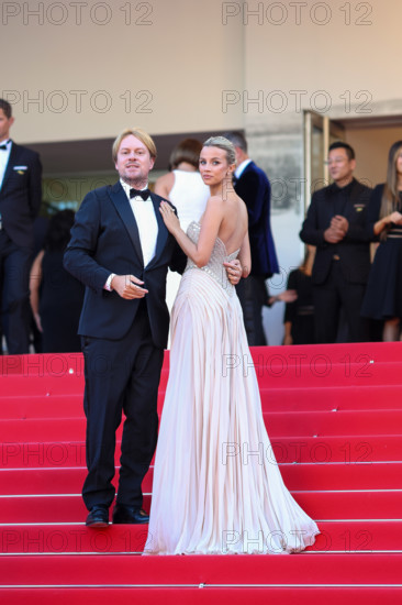 Simona Jakstaite (in Georges Hobeika) and Christopher Aleo attend the "Histoires De La Nuit" (The Birthday Party) screening during the 79th annual Cannes Film Festival at Palais des Festivals on May 22, 2026 in Cannes, France.