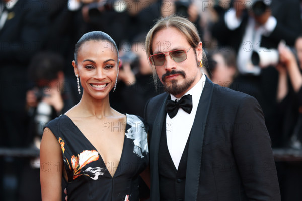 Zoe Saldaña (in Chanel) and Marco Perego attend the closing ceremony of the 79th annual Cannes Film Festival at Palais des Festivals on May 23, 2026 in Cannes, France