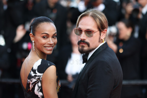 Zoe Saldaña (in Chanel) and Marco Perego attend the closing ceremony of the 79th annual Cannes Film Festival at Palais des Festivals on May 23, 2026 in Cannes, France