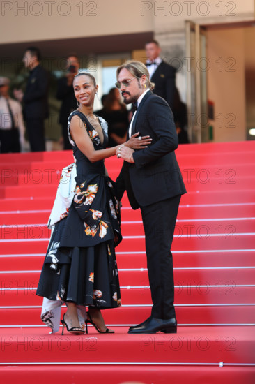 Zoe Saldaña (in Chanel) and Marco Perego attend the closing ceremony of the 79th annual Cannes Film Festival at Palais des Festivals on May 23, 2026 in Cannes, France
