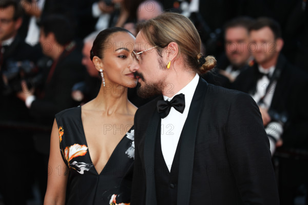 Zoe Saldaña (in Chanel) and Marco Perego attend the closing ceremony of the 79th annual Cannes Film Festival at Palais des Festivals on May 23, 2026 in Cannes, France