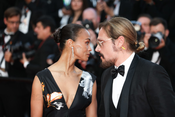 Zoe Saldaña (in Chanel) and Marco Perego attend the closing ceremony of the 79th annual Cannes Film Festival at Palais des Festivals on May 23, 2026 in Cannes, France