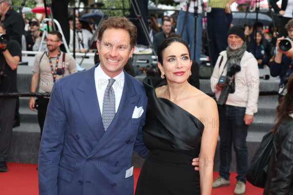 Marco Colombo and Randi Ingerman attend the "L'Inconnue" (The Unknown) screening during the 79th annual Cannes Film Festival at Palais des Festivals on May 18, 2026 in Cannes, France.