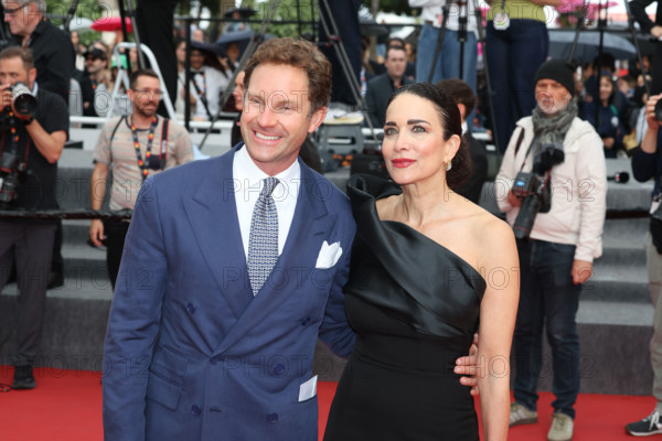 Marco Colombo and Randi Ingerman attend the "L'Inconnue" (The Unknown) screening during the 79th annual Cannes Film Festival at Palais des Festivals on May 18, 2026 in Cannes, France.