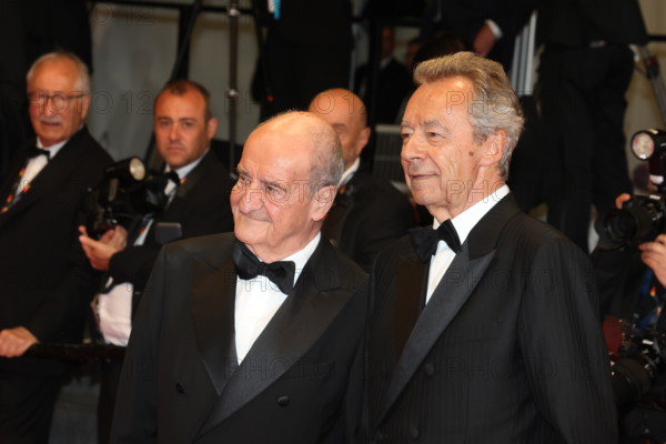 Michel Denisot and Pierre Lescure attend the "Coward" screening during the 79th annual Cannes Film Festival at Palais des Festivals on May 21, 2026 in Cannes, France.