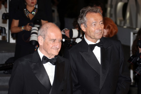 Michel Denisot and Pierre Lescure attend the "Coward" screening during the 79th annual Cannes Film Festival at Palais des Festivals on May 21, 2026 in Cannes, France.